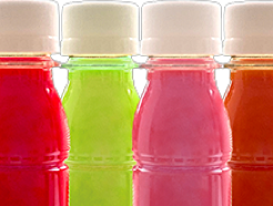 Energy shot beverages in red, lemon green, pink and organge at Nutrition Laboratories.