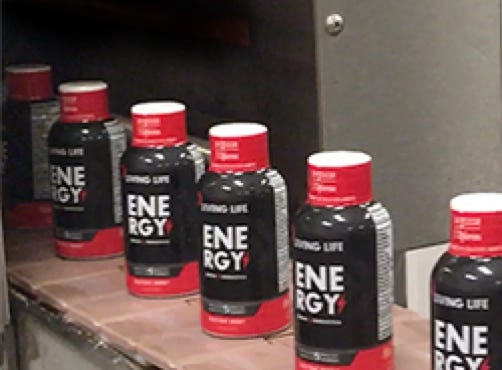 2oz energy shots coming out from shink tunnel at Nutrition Laboratories.