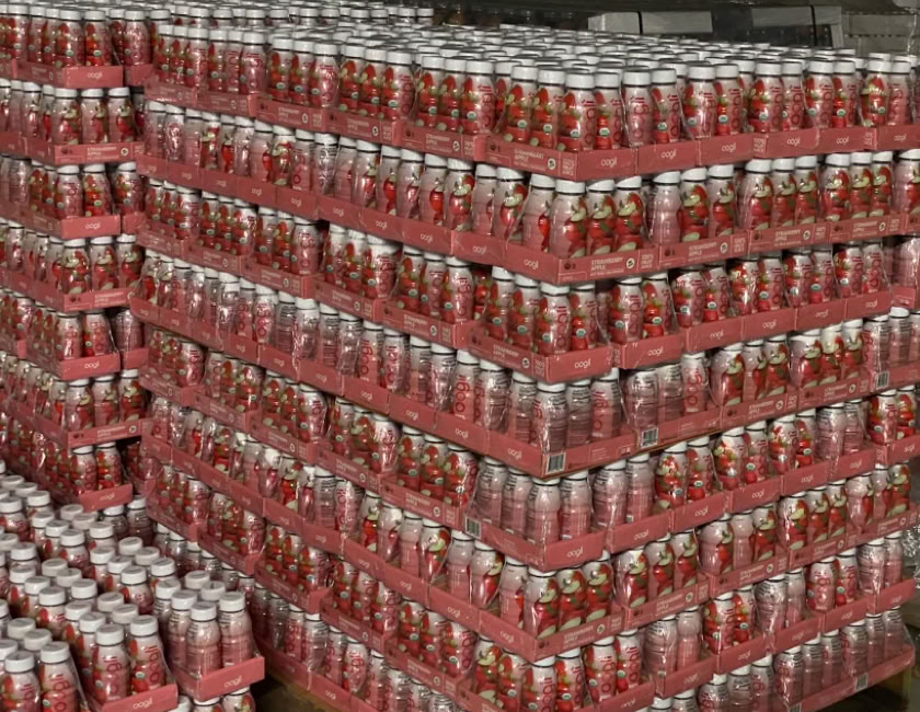 Beverages packed in trays for Costco and stacked on pallets for distribution at Nutrition Labs 