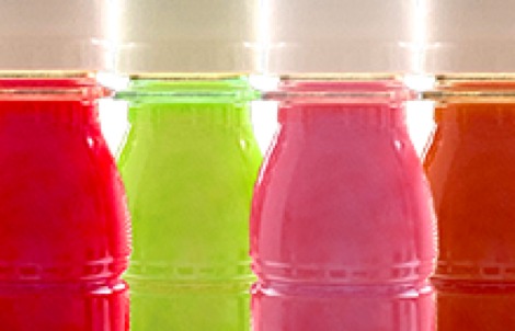 Energy shot bottles prepared for hot filling at Nutrition Labs beverage co-packing facility